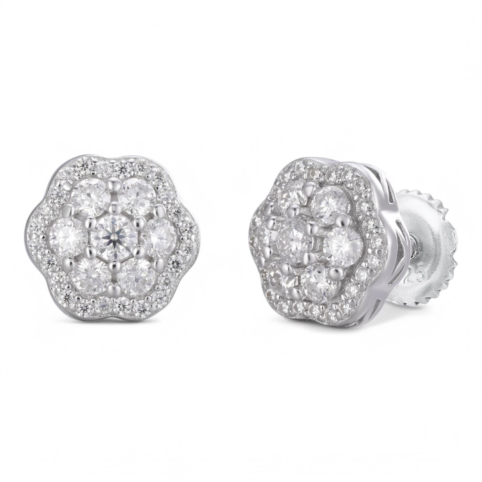Silver floral earrings with clear gemstones on a white background