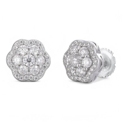 Silver floral earrings with clear gemstones on a white background